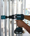 Using Hard Core Bad Boy 18V Cordless Hammer Driver Drill Kit with 1/2 inch chuck for drilling through metal stud.