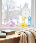 Super Vibrant Sixty Piece Zinc Alloy Keychain Clips With Swivel Lobster Claw Clasps, colorful clips on window sill, ideal for bag charms.