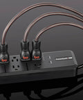 PowerQuest G8 8-Outlet Surge Protector with cables and flat-to-wall plug, shown in black with Micro Spike Protection and RF Noise Dissipation