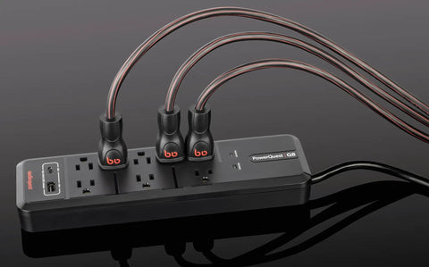 PowerQuest G8 8-Outlet Surge Protector with cables and flat-to-wall plug, shown in black with Micro Spike Protection and RF Noise Dissipation