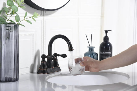 Oil Rubbed Bronze Centerset Bathroom Faucet With Two Handles For Three Hole Sinks 4 Inch Swivel Spout Overflow Pop Up Drain Lead Free Waterway Ceramic Cartridge Durable Brass Easy DIY Install filling glass with water