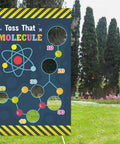 Science Toss Banner Backdrop for Chemistry Party Decor Molecule Theme School Lab Classroom Decorations Party Supplies Favors and Photo Booth Background for Birthday Celebrations and Classroom Activities Totally Party Ready Science Game with molecule design in a garden setting.