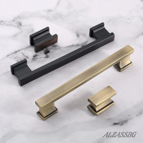 10 Pack Brushed Antique Brass Cabinet Knobs, 1.46 Inch Rectangle Kitchen Hardware Knobs For Cabinets And Drawers, Solid Aluminum Alloy AL6061AB displayed on marble