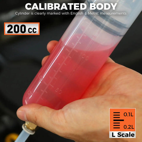 Hand holding 200cc Fluid Extractor Syringe Oil Pump With 23 Inch Flexible Hose, metric measurements visible on syringe