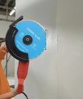 Heavy Duty 14 Inch Circular Concrete Saw With 3000 Watt Electric Motor And Tough As Nails Build For Ripping Through Masonry Machines Featuring Deep Five Point Three One Inch Cutting Depth with diamond blade cutting a wall.