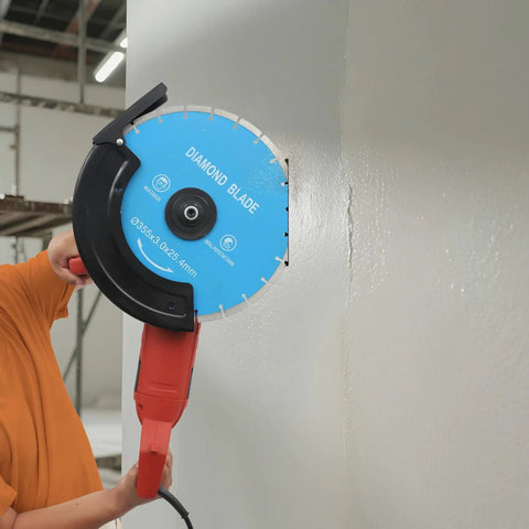 Heavy Duty 14 Inch Circular Concrete Saw With 3000 Watt Electric Motor And Tough As Nails Build For Ripping Through Masonry Machines Featuring Deep Five Point Three One Inch Cutting Depth with diamond blade cutting a wall.