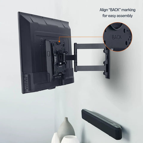 Back view of a TV mounted with Built Tough Full Motion TV Wall Mount With Effortless Swivel And Tilt Angles For Twenty Six To Fifty Five Inch Screens Handling Up To Eighty Pounds Seamless VESA Compatible Single Stud Install In Sleek Black.
