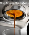 Close-up of espresso extraction from a dual boiler espresso machine with integrated grinder and 20 bar pump.
