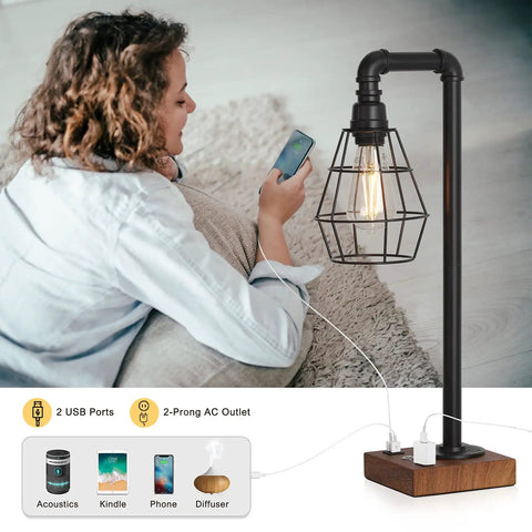 Industrial Style Touch Control Table Lamp With LED Bulb Included, 3 Way Dimmer, 2 USB Ports And AC Outlet next to woman