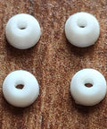 Four white PU bushings from 10 Sets Pro Fingerboard Truck Bushings Orange And White PU Material Fits All Pro Fingerboard Trucks