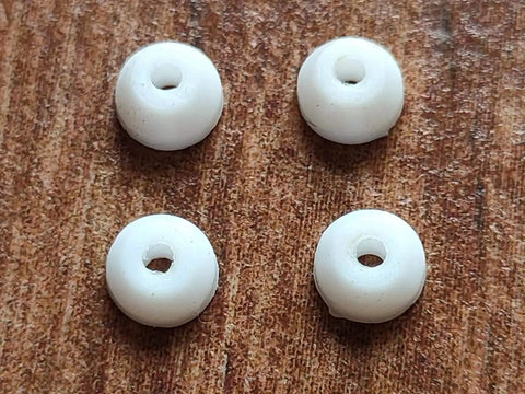 Four white PU bushings from 10 Sets Pro Fingerboard Truck Bushings Orange And White PU Material Fits All Pro Fingerboard Trucks
