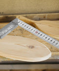 Stainless Steel 90 Degree Ruler L Square Measuring Tool for Carpenters and Machinists on wooden surface, showing precision angle.