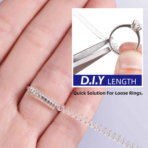 Close-up of Invisible Ring Size Adjuster Kit 16 Soft Silicone Guards with adjustable spiral tighteners being applied to a ring.
