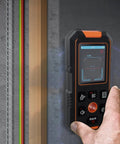 NF-513 Wall Stud Finder and Metal Detector, 2.4 Inch Color Display, Type-C used on a wall for accurate detection.