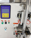 Automatic Paste And Liquid Filling Sealing Machine With Horizontal Mixing Hopper For Chili Sauce And Juice 30 To 300 Ml Bottle Filler control panel close-up showing buttons and pneumatic system.