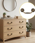 12 Pack Antique Bronze Drop Bail Pulls For Cabinets And Dressers, 3.5 Inch Center To Center, on a modern wooden dresser.