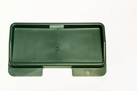 Top view of green commercial quality golf ball tray for practice mats high impact plastic flange sits under mat to keep tray in place