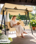 Outdoor Porch Swing With Adjustable Canopy And Heavy Duty Stand, beige cushions, woman reading on porch glider.