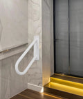 18 Inch Tough As Nails Metal Outdoor Handrail U Shaped White Powder Coated Wall Mount Stair Railing With Non Slip Grip installed in modern hallway.