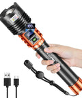 Hand holding Rechargeable LED Flashlight 90,000LM Beast Bright with LCD Display, 5 Modes, waterproof and 10000mAh battery, orange