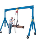 Heavy Duty Adjustable Height Gantry Crane 6000 Lb Capacity 15 X 10 Ft Steel Frame Built Tough lifting pipes with a worker.