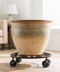 Large ceramic pot on Three Pack Heavy Duty Metal Plant Caddies With Wheels 13.5 Inch Rolling Plant Stand Dollies indoors