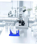 Hands On Pendulum Educational Tool For Physics Experiments In Middle School Classrooms beside a microscope on a lab table