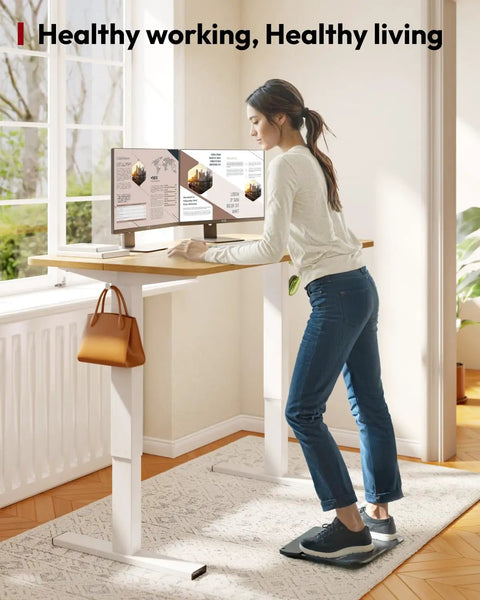 Spacious 40 Inch Height Adjustable Electric Standing Desk With Stable Base Perfect For Home Office, ergonomic workstation with a person working.