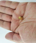 Gold-plated SMA dust cap for SMA female jack held in hand, part of 12 Pack SMA Plug Dust Cap For SMA Female Jack Gold Plated RF Coaxial Connector Protective Cap Guard For Your Coaxial Gear Up To 18 GHz Low Reflection And Top Notch Shielding Accessories.