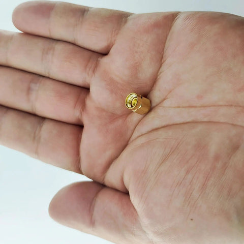 Gold-plated SMA dust cap for SMA female jack held in hand, part of 12 Pack SMA Plug Dust Cap For SMA Female Jack Gold Plated RF Coaxial Connector Protective Cap Guard For Your Coaxial Gear Up To 18 GHz Low Reflection And Top Notch Shielding Accessories.