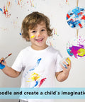 Child painting with 12 Pack Ceramic Ornament Blanks For Sublimation DIY Crafts, featuring colorful abstract designs.