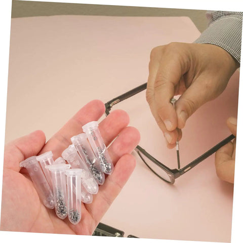 Person using small screwdriver from Glasses Repair Kit Full Set With Screws Nose Pads Eyeglass Screwdriver And Ear Grips For Quick On The Go Eyewear Fixes Sunglasses Versatile Portable Tool Kit For Home Or Travel to fix eyeglasses.