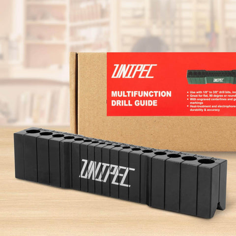 Precision Drill Guide For Straight Holes Compact Portable Drilling Block For Wood Metal And Plastic SAE One Eighth To Three Eighths Inch Sizes Keeps Drill Bits Aligned For Cleaner And More Accurate Holes on a table in front of packaging.