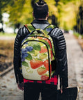 Man wearing Mixed Berry Vine Watercolor Printed Unisex Backpack Large Capacity Durable Polyester Breathable Design With Sturdy Zipper Ideal For School Work Travel And Everyday Carry while holding skateboard on tree-lined path
