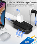 US To Europe 2300W Must Have Travel Power Converter 220V To 110V with 3 USB ports and plugged devices shown on desk