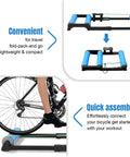 Whisper Quiet Cycling Trainer Platform With Anti Slip Foldable Aluminum Roller, compact design with bike wheel attached for indoor use.