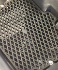 Black metal grate, part of 85 Lb Spreader Grate Kit For Push And Tow Spreaders, Pro Grade Upgrade That Improves Material Flow And Spreader Performance.