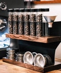 Badass Two Tier Coffee Bean Cellar With Built In Hopper And One Way Exhaust Valve For Fresh Single Dose Roasts, with test tubes and a brewing rack.