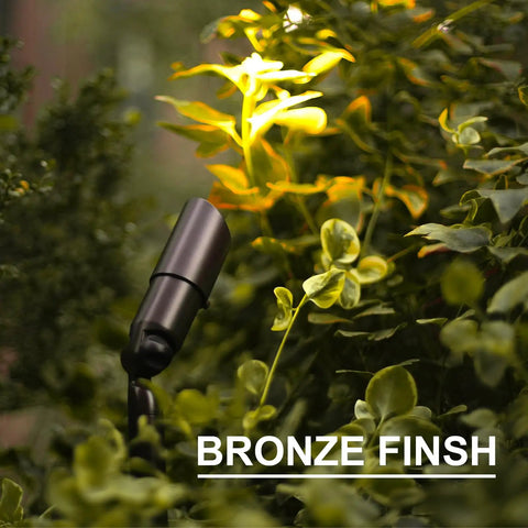 Low Voltage Landscape Spotlight Kit 8 Pack, 20W Halogen Outdoor Lights illuminating garden foliage with bronze finish