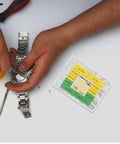 Person adjusting a watch band using No Sweat Heavy Duty Stainless Steel Watch Screws Assortment Set for repairs.