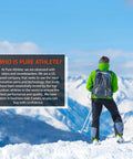 Skier in green jacket on snowy mountain, highlighting Elite Wool Race Ski Socks For Cold Weather Skiing And Snowboarding, Comfy And Breathable.