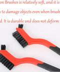 Two cleaning brushes with black nylon bristles and red durable plastic handles from Three Piece Nylon Cleaning Brush Set For Rust Removal In Holes And Tight Spaces Durable Plastic Handles Non Marring Bristles Heavy Duty Grime Busting Cleaning For Rust And Dirt In Small Crevices