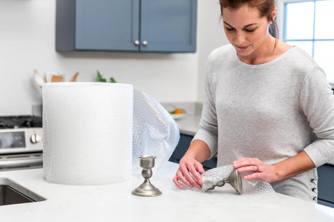 Pro Grade Small Bubble Cushioning Wrap For Moving And Shipping 175 Ft Perforated Bubble Roll in use for fragile items