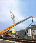 Mini Portable Crawler Crane Rig With Smart Wireless Remote Hydraulic Lift Machine Fully Kitted Out lifting materials at a construction site.