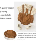 Dope Snap Button Kit with 100 sets metal snaps and fastener pliers press tool attached to brown baby romper with bear print detail.