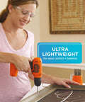 Woman using Ultra Lightweight 8V Max Cordless Drill Driver For Home DIY with keyless chuck on a chalkboard in home setting.