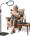 Elderly woman using 10X Magnification LED Lighted Magnifier With Stand And 7 Inch Lens For Reading And Detail Work, Cross Stitch And Crafts