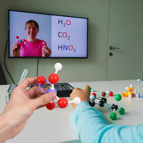Students using Molecular Modeling Kit For Chemistry Students With 63 Atom Balls And 86 Bond Pieces in a classroom setting