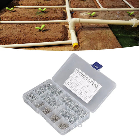 Beefy Spring Hose Clamp Kit 5 to 14mm Stainless Steel Double Wire Spring Clips next to an irrigation setup
