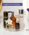 Four Pack 9 Inch Clear Acrylic Lazy Susans Non Skid Turntables Organizer with cosmetics on vanity countertop.
